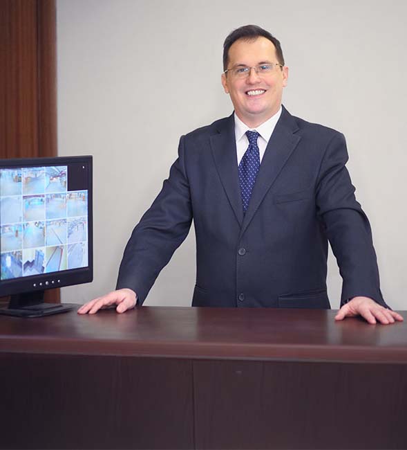 security officer in a suit at an office reception desk