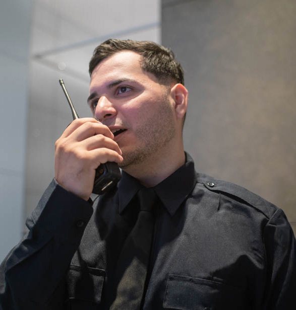 security officer talking into a radio